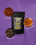 Mayan Jaguar Guatemala coffee package with hazelnuts, caramelized sugar, and dark chocolate on a purple background